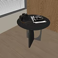 Stylish Modern Round Side Table With Vintage Camera Magazine And Unique Leg Design