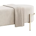 Modern Beige Upholstered Sofa Bench With Golden Metal Legs And Soft Throw Blanket