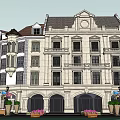 Traditional Commercial Street With Multiple Buildings Green Spaces And Pedestrian Walkways