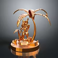 Golden Decorative Sculpture With Palm Tree Figure And Circular Shiny Base