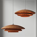 Two Minimalist Modern Rattan Pendant Lights With Layered Design In Warm Brown Interior