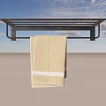 Hanging Beige Towel With White Stripes on Black Towel Rack Against Grey Background