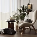 Cozy Cream Colored Accent Chair With Wooden Legs Green Plants And Side Table