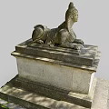 Intricate Stone Sphinx Sculpture Carving On Pedestal With Mossy Base In Outdoor Setting