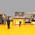 Business Equipment Display Stands in Circular Arrangement with People at Exhibition
