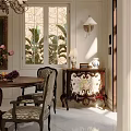 Classic Restaurant Dining Space With Round Wooden Table Patterned Chairs Vase Flower Bouquet And Framed Painting