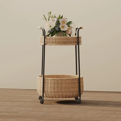 Two Tier Wicker Side Table With Rolling Wheels And Decorative Flowers On Top 3d model