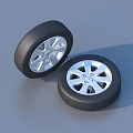 Black Rubber Car Tires Featuring Silver Alloy Wheels And Spoke Design