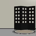 Black Three Panel Room Divider With Circular Cutouts And Round Patterned Rug