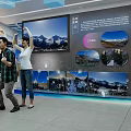 Cultural Center Interior With Visitors Exploring Exhibition Murals Digital Screens And Decorative Flags