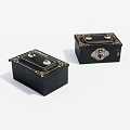 Two Black Decorative Boxes With Golden Accents And Metal Clasps
