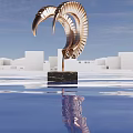 Golden Spiral Shaped Sculpture with Black Marble Base Amid White Buildings And Water Surface