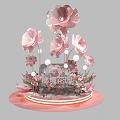 Elegant Floral Installation with Large Pink Paper Flowers and Decorative Base Lighting