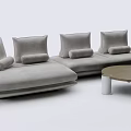 Modern Gray Sectional Sofa With Plush Pillows And Round Wooden Coffee Table 3d model