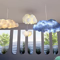 Yellow White Blue Cloud Shaped Pendant Lights Hanging Over Indoor Sea View Window
