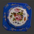 Blue Decorative Perfume Bottle With Floral Designs And White Enamel Lid