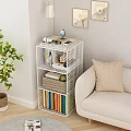 White Grid Bookcase With Colorful Books And Decorative Items In Living Room