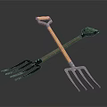 Two Garden Forks With Wooden Handles And Metal Tines Crossed