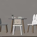 Cute Children's Table And Chairs With Cartoon Bunny Design And Stationery On Wooden Legs