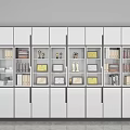 Modern White Bookcase With Black Handles Filled With Books Trophies Photo Frames And File Boxes
