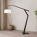 Modern Black Floor Lamp With White Lampshade In Wooden Interior With Vase And Green Plant