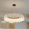 White Petal Shaped Chandelier With Wooden Ring Hanging In Minimalist Interior Space