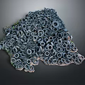 Tire Sculpture With Stacked Tires And Green Plants On Dark Background