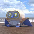 Large Colorful Cartoon Owl on Wooden Platform With Blue Sky White Clouds and Railing