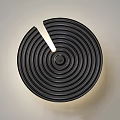 Modern Black Round Wall Lamp With Spiral Design And Illuminated Center