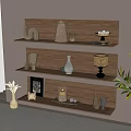 Stylish Decorative Ornament Collection On Wooden Shelves With Vase Candle Holder And Green Plant
