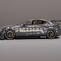 Sporty Car Design With Dark Gray Exterior Gold Wheels Rear Spoiler And Orange Seats