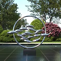 Garden Landscape Featuring Circular Metal Sculpture Wavy Design Green Shrubs Purple Plants And Paved Ground