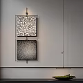 Abstract Textured Paintings Hanging On White Wall With Framed Design And Black White Patterns
