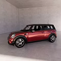 Red Five Door Compact Car With Black Roof And Alloy Wheels In Gray Indoor Showroom