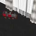 Electric Toy Train with Red and Black Design on Wooden Floor