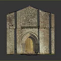 Historic Stone Building Exterior With Arched Wooden Door And Moss Covered Walls