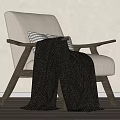 Modern Minimalist Leisure Chair With Light Fabric Seat Dark Wooden Armrests And Cozy Blanket