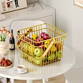 Assorted Fresh Fruits in Golden Wire Basket on White Table with Fresh Strawberries
