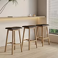 Modern Bar Stools with Wooden Frame and Black Cushion in Bright Room Setting