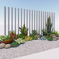 Mixed Succulent Plants Display With White Vertical Slat Fence On Gravel Ground