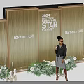 2024 STAR METEOG Red Carpet Photo Op Spot with Golden Backdrop Green Plants White Flowers