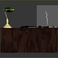 Wooden Office Desk Featuring Green Lamp Gold Base Green Mat Tools White Cup And Steaming Glass