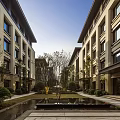 Modern Multistory Residential Exterior With Green Landscape And Leisure Seating Area