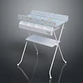 Portable Baby Changing Table With White Metal Frame And Colorful Patterned Pad