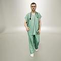 Man in Green Scrubs With Stethoscope Standing Against Gray Background