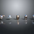 Various Styles of Shiny Metal Helmets Arranged on Dark Background