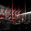 Elegant Banquet Hall Setup With Long Dining Tables Black Chairs And Red Stage Lighting