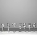 Elegant Wine Bottles and Crystal Glasses Collection Arranged on Modern Wooden Table for Home Bar