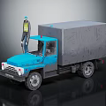 Blue Truck With Gray Cargo Box And Worker In Yellow Vest