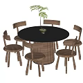Round Black Dining Table Set With Six Wooden Chairs And Woven Seats Plus Potted Plant